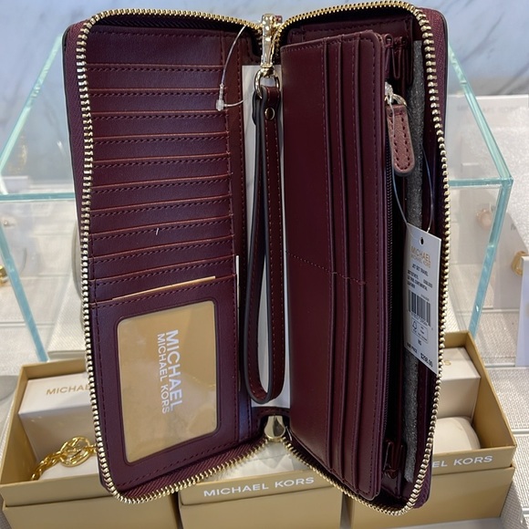 MICHAEL KORS
Leather Continental Wristlet Phone Case Wallet 
Oxblood 
NWT 
M - Picture 8 of 16